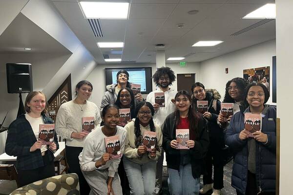 Book club participants with their copies of The Color Purple